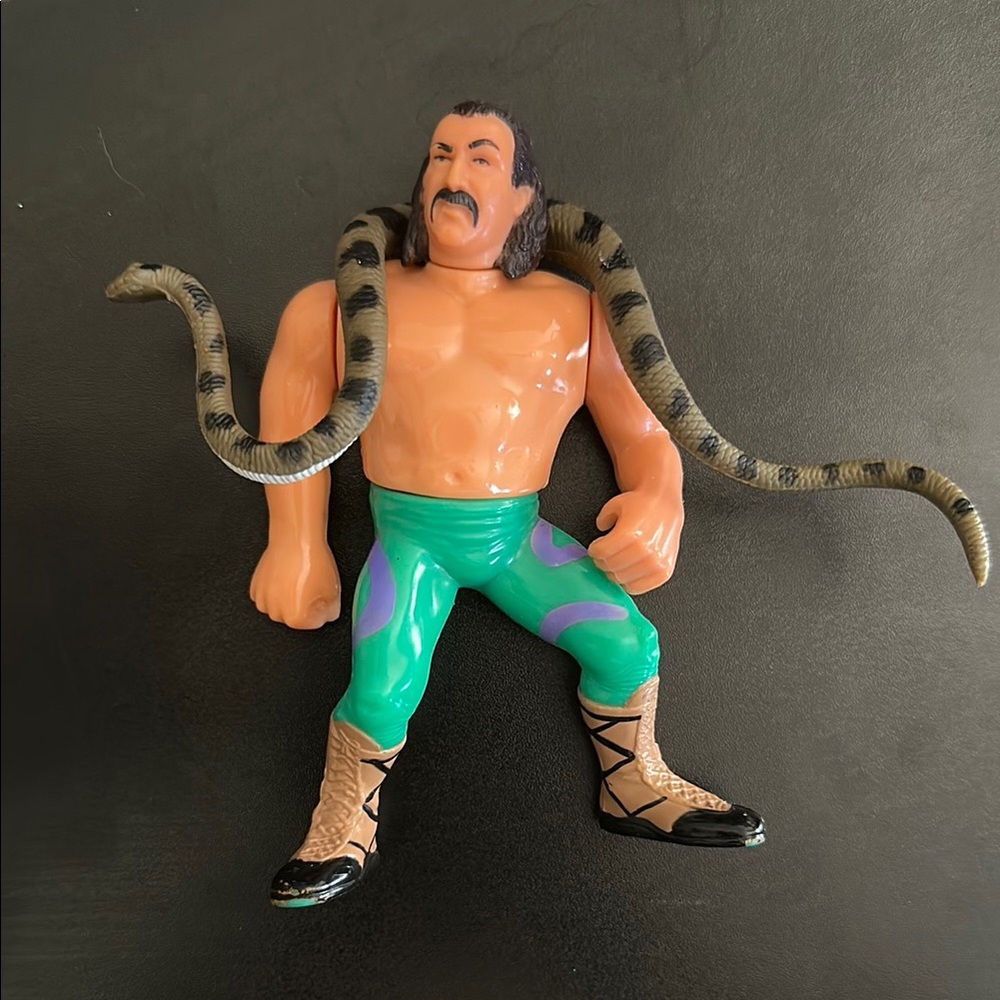 1990 Jake the Snake Roberts with Damien